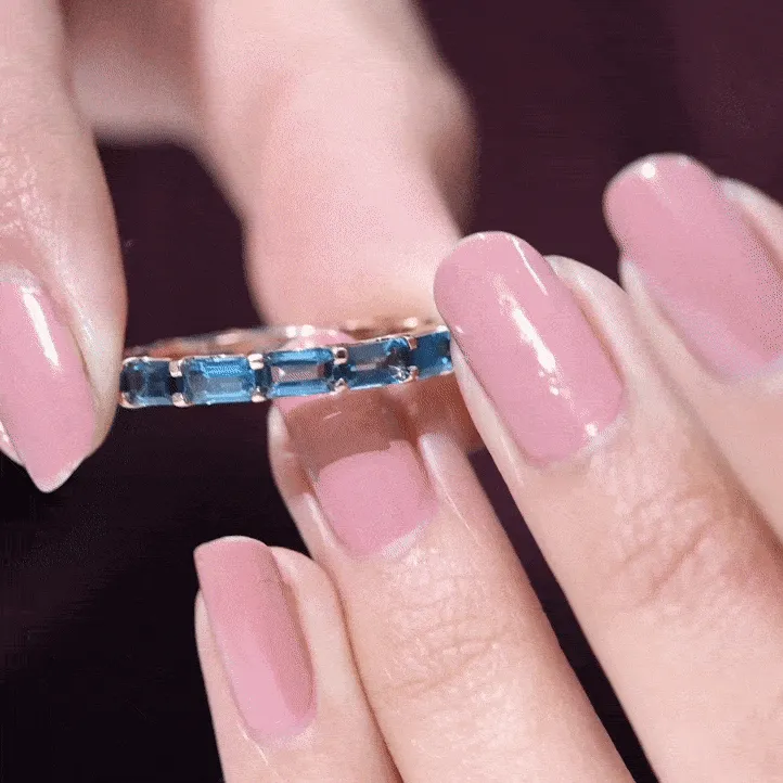 Shared Prong Set Octagon Cut London Blue Topaz Eternity Ring