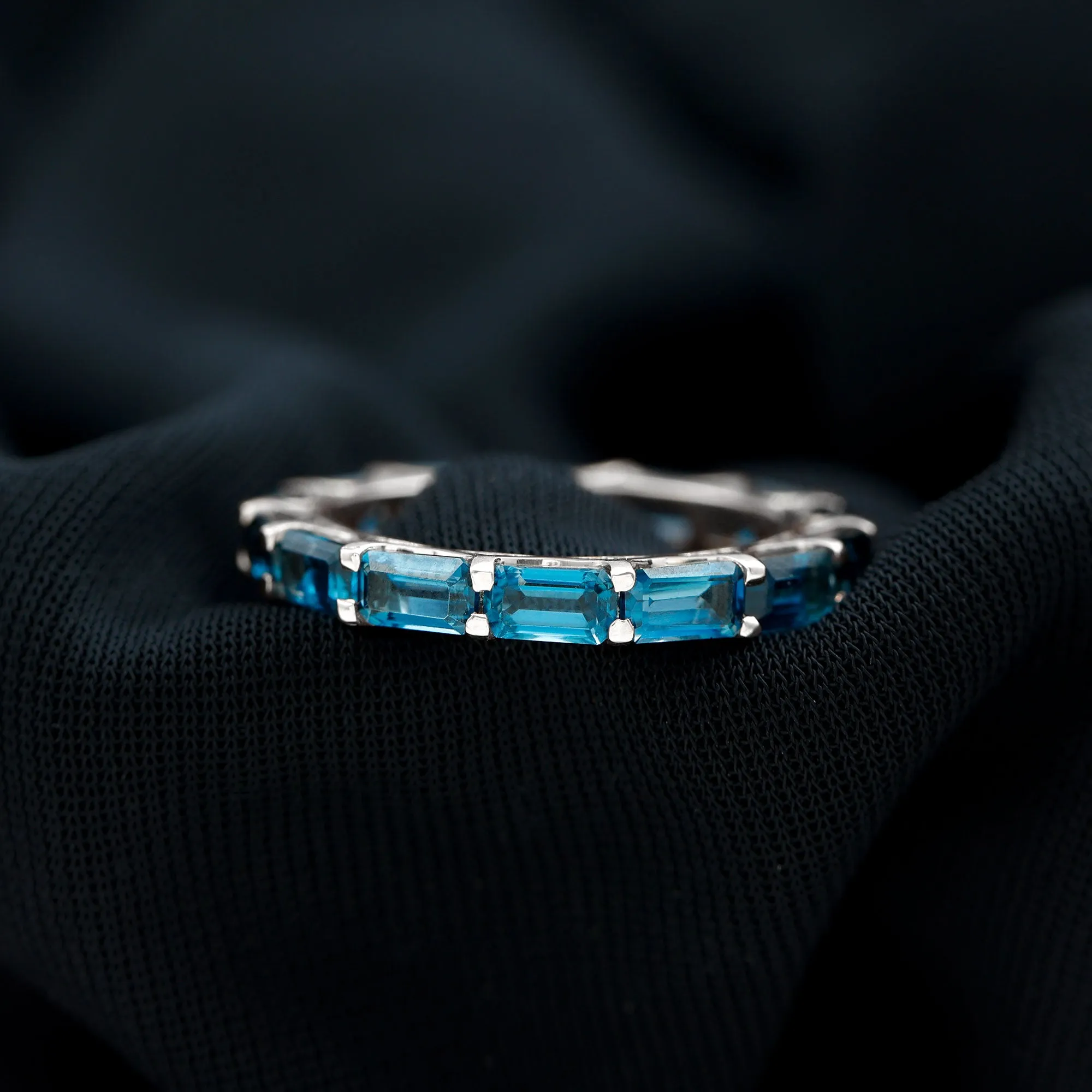 Shared Prong Set Octagon Cut London Blue Topaz Eternity Ring