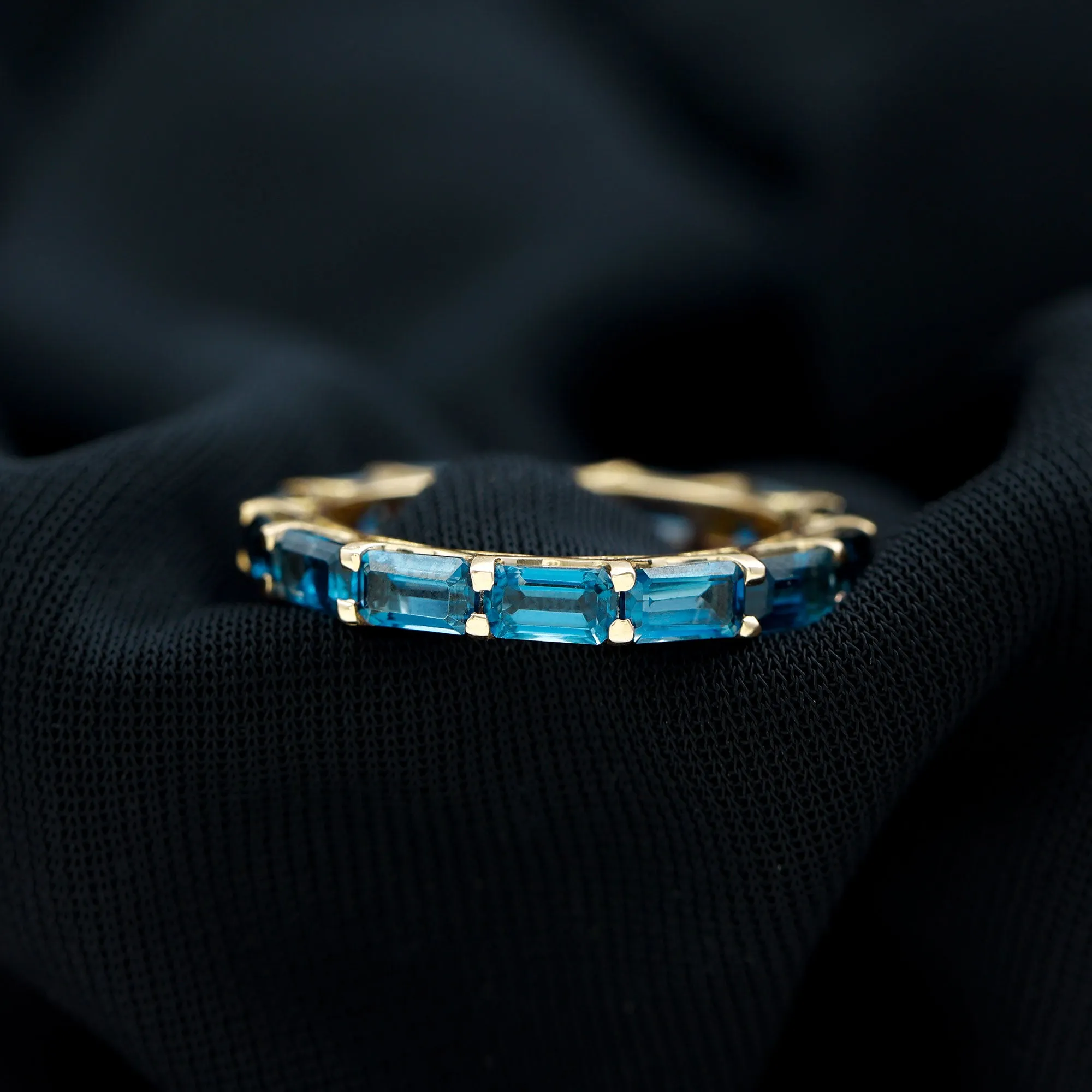 Shared Prong Set Octagon Cut London Blue Topaz Eternity Ring